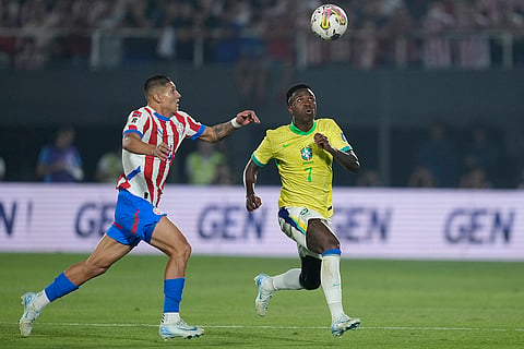 2026 FIFA World Cup Qualifying, Brazil vs Paraguay: Brazil's Vinicius Junior, right, and Paraguay's Hugo Cuenca eye the ball 